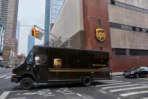A UPS truck leaves a UPS facility in New York City